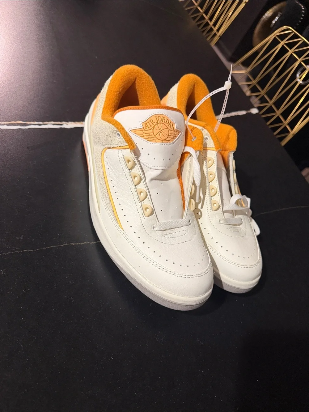 Jordan White and Orange Low-Top Sneakers with Gold Logo Accent